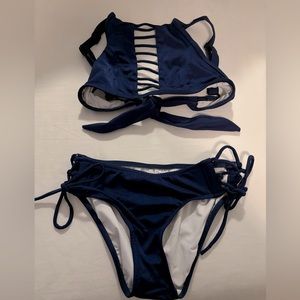 Adorable VENUS bikini. Good coverage on bottoms and cute cut out detail in top.